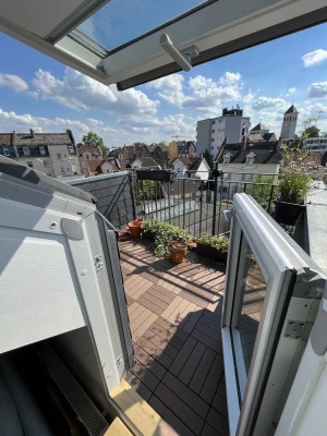 2 ZKB mit sonniger Dachterrasse und offenem Gebälk