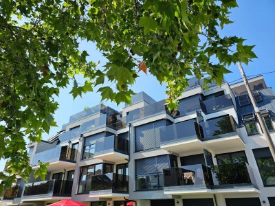 2-Zimmer Erdgeschosswohnung mit Terrasse, Garten und Tiefgaragenplatz