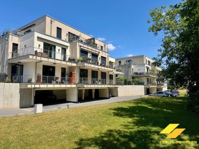 Hochwertig ausgestattete barrierefreie Erdgeschosswohnung mit Balkon und Garten