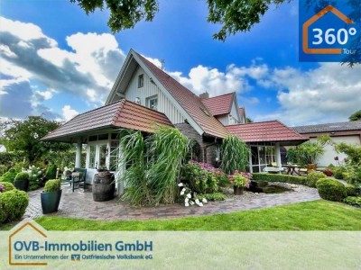 Hochwertiges Wohnhaus im Landhausstil mit liebevoll angelegtem Garten und großer Halle
