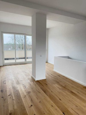 Erstbezug: Helle Maisonette-Wohnung mit Südterrasse, eigenem Seezugang und großzügiger Parkanlage