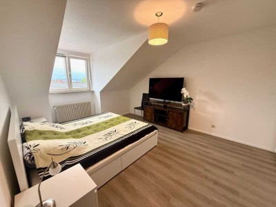 Attraktive Kapitalanlage in Grenznähe – vermietete 2-Zimmer-DG-Wohnung mit TG-Stellplatz