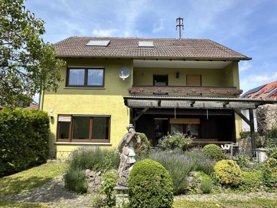 Ein-/Zweifamilienhaus mit Garage und Garten