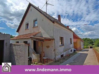 Aschbach: Vermietetes Einfamilienhaus mit umfassendem Sanierungsbedarf