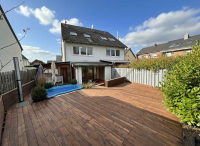 Charmante Doppelhaushälfte mit Wintergarten, Garten und vielseitigen Nutzungsmöglichkeiten