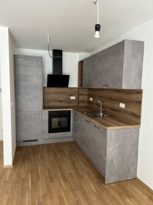 Charmante 2-Zimmer-Wohnung mit Terrasse, Garten & Tiefgaragenstellplatz