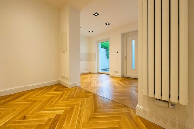 Gute Kapitalanlage! Wunderschöne, ruhige Remisen Neubau-Gartenwohnung mit Terrasse.