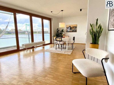 Erste Rheinlage: Bezugsfreie, neuwertige Wohnung mit Tiefgaragenstellplatz