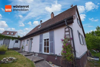 Kleines Familienhaus in Poppenlauer: Solide Basis mit Holzofen & viel Gestaltungsfreiraum!