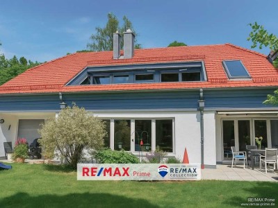 Grünwald: Stilvolle Architektur in Toplage – Villenhälfte in Waldrandlage