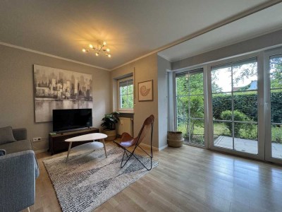 Helle 2-Zimmer-Wohnung mit Terrasse, Garten und Garage in sehr ruhiger Lage