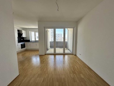 Moderne 2-Zimmer Mietwohnung im Neubaugebiet Sonnenrain  
mit Aufzug, Balkon, EBK, TG-Stellplatz u.