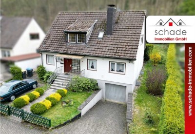 SCHADE IMMOBILIEN - Einfamilienhaus mit vermieteter Einliegerwohnung und viel Potenzial in Hemer!
