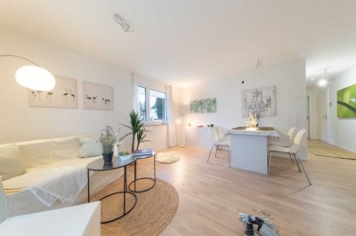 Neubau - Idyllisch, modern, gut angebunden: 2 Zimmer Wohnung mit EBK, Terrasse und Gartenanteil