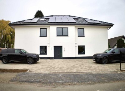 Exklusive 4-Zimmer Neubauwohnung im Maisonettenstil nach KfW 40ee Standard in Löhne mit Balkon