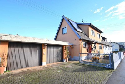 Bezugsfreie Erdgeschosswohnung mit Garage, Gartenanteil und ausgebautem Zimmer im UG