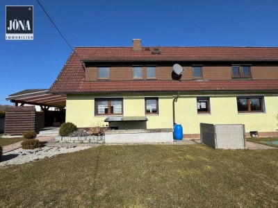 Charmant sanierte Wohnimmobilie mit großem Garten und Doppelgarage in einem angenehm ruhigen Umfeld