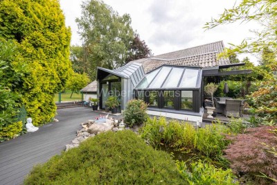 Exklusives HUF HAUS mit Wintergarten, Sauna + Gartenoase "Wohnen in seiner schönsten Form"
