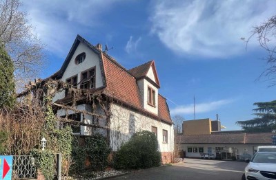 Wohnhaus mit vermieteter Gewerbefläche