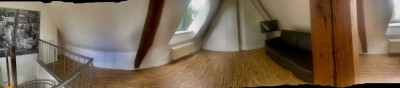 Angeboten wird ein Studiozimmer mit separater Einbauküche und gemeinschaftlichem Badezimmer