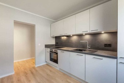 Erstbezug: Sanierte Wohnung inklusive Einbauküche, Garage und Gartenanteil!
