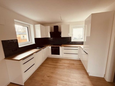 Neubau-Erstbezug: 3 Zimmer Terrassenwohnung in Hoppegarten mit Garten