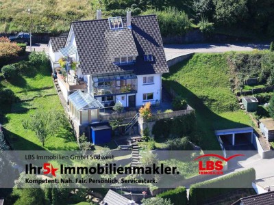 Vielseitiges Dreifamilienhaus mit exzellenter Aussicht!