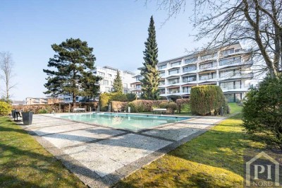 Licht, Lage, Lebensqualität – 1,5-Zimmer-Wohnung mit Terrasse und Pool direkt an der Promenade