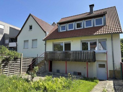 Älteres 1-2 Familienhaus mit Garten und Garage – mitten in der Stadt