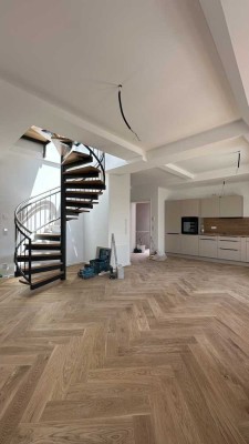 Erstbezug - stilvolle Penthousewohnung mit spektakulärer Dachterrasse & Blick über ganz München
