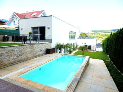 Architect-designed villa with heated saltwater pool - distant views and forest access - "a must see"
