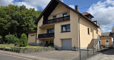 Freistehendes Einfamilienhaus mit vielseitigem Raumangebot und idyllischem Garten!