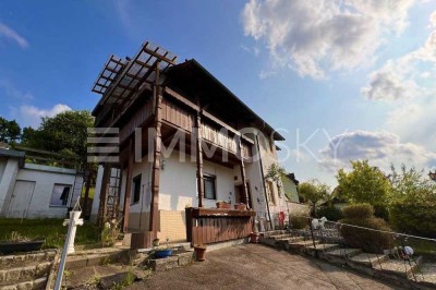 Charmantes Einfamilienhaus mit Garten, Steinofen und Ausbaureserve!