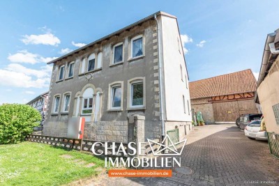 Vollvermietetes Dreifamilienhaus mit großflächiger Scheune - Wohnen und Arbeiten in Thüste!