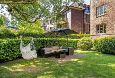 Altbau-Charme im Hochparterre mit Loggia und Gartenidylle, fußläufig zur Waitzstraße