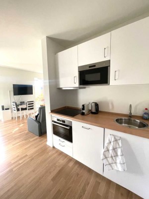Möblierte 1-Zimmer-Neubauwohnung mit Südterrasse und Gartenanteil