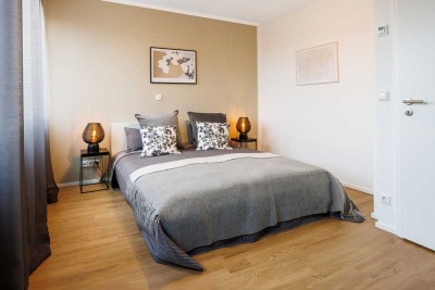 Platz für die ganze Familie: Neubau Mietshaus mit Garten und Garage