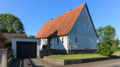 Gemütliches Einfamilienhaus mit Potential und Nebengebäude in Ortsrandlage von Crainfeld!