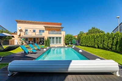 HEGERICH: Grosszügige Villa mit Garten und Pool für die gesamte Familie