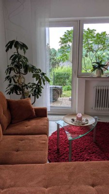 Helle Souterrainwohnung mit Terrasse in begehrter Wohnlage