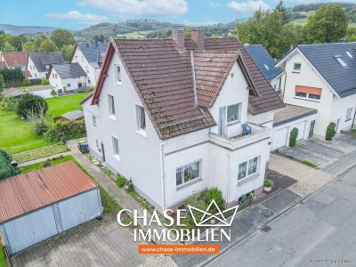 Charmante Doppelhaushälfte mit eigenem Garten und Garagen - Wohnen in TOP-Lage Lügdes!