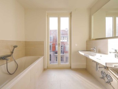 Lichtdurchflutete 3-Zi.-Wohnung mit stilvollem Badezimmer, Sonnenbalkon und Tiefgaragenplatz