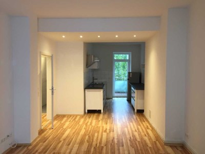 Stilvolle 2-Zimmer-Wohnung mit großer Wohnküche & grünem Balkon