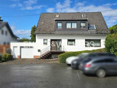Einfamilienhaus mit Garten und Garage in begehrter Lage