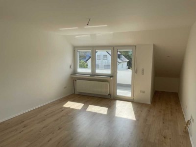 Charmante, teilsanierte DG-Wohnung mit 59 m² in Dortmund-Brackel – Garage mit Wallbox optional