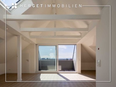 Erstbezug: Loftartige 2,5-Zimmer-Wohnung mit Einbauküche, Balkon & Traumblick