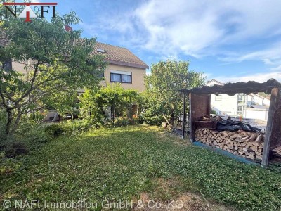 **Idyllisches Zuhause: Helle 3,5-Zimmer-Wohnung mit Gartenanteil und Garage**