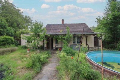 Verwirklichen Sie Ihre Wohnträume – Sanierungsbedürftiges Einfamilienhaus mit Nebengelass und Anbau