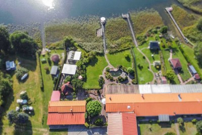 Direkt am See: Gepflegtes 4-Zi.-Zuhause mit einzigartigem Grundstück, Bootssteg und Einliegerwhg.