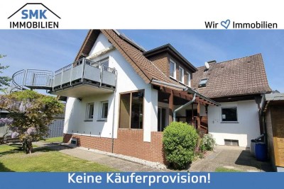 Modernisiertes Zweifamilienhaus mit
Garten, Garage & Carport!